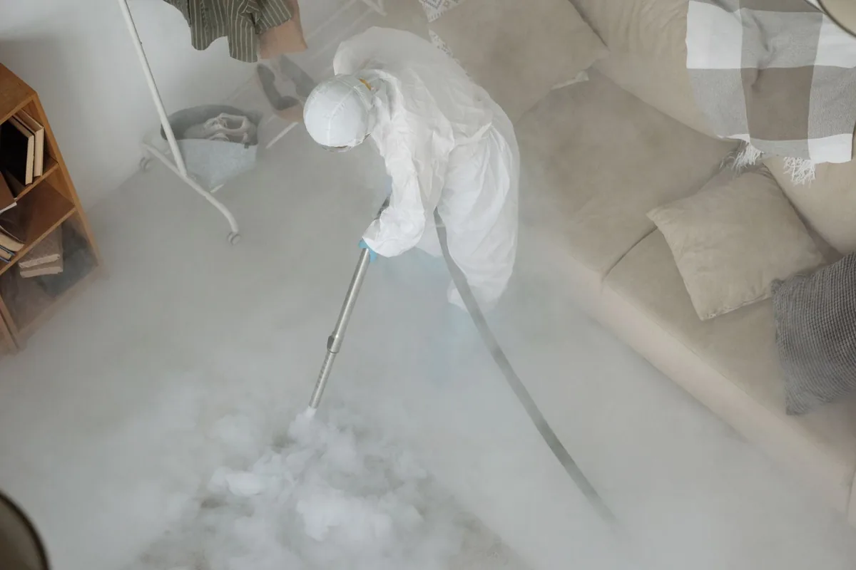 Biohazard cleanup technician in protective equipment, East Carbon, UT